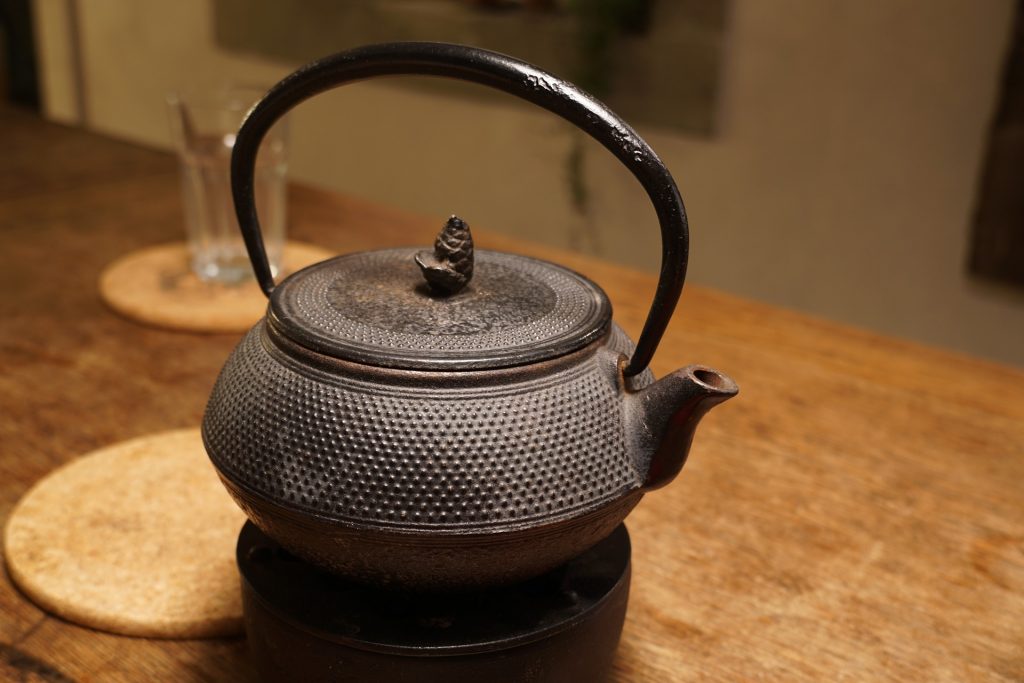 rusty cast iron tea kettle
