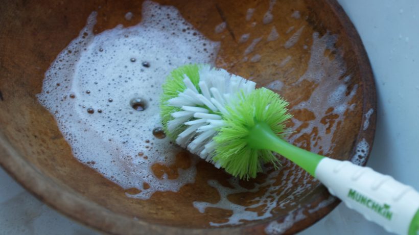 How do you clean and sterilize a wooden bowl?