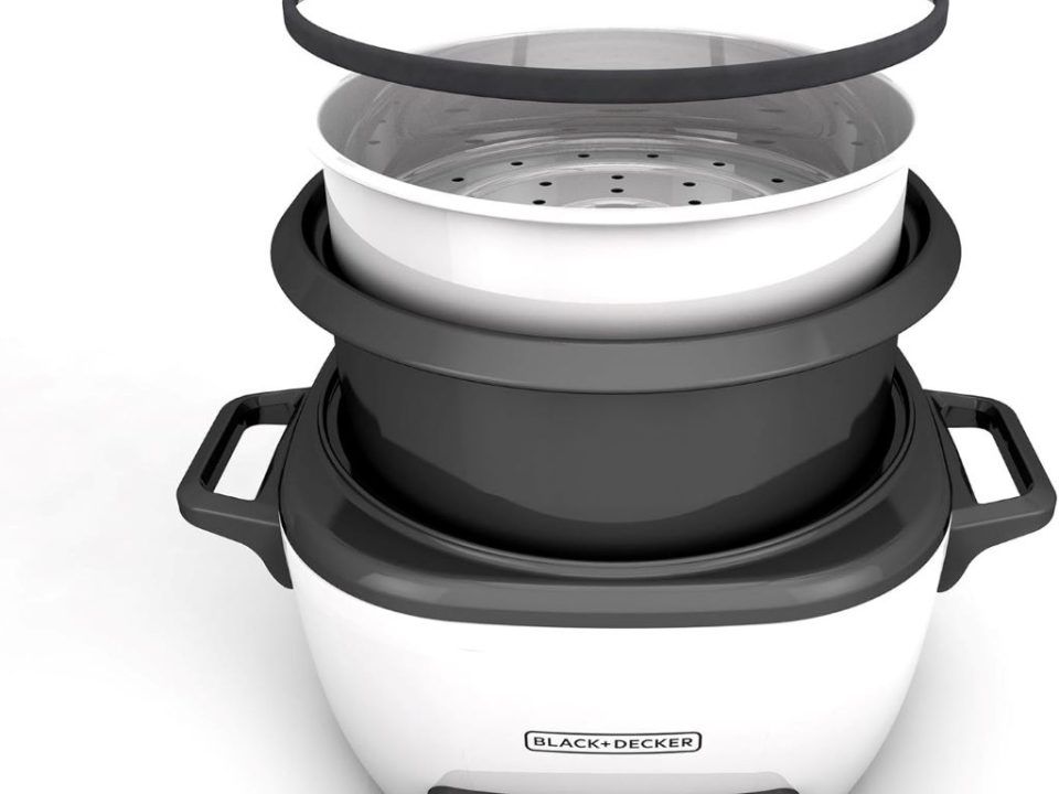 White BLACK+DECKER rice cooker with non-stick interior and steaming basket for easy meal prep.