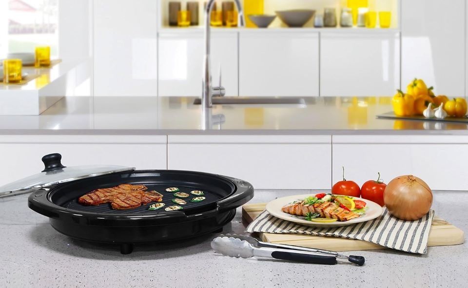 Elite Gourmet 14-inch smokeless electric grill with nonstick surface, ideal for indoor tabletop BBQ cooking.