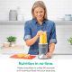 Close-up of Nutribullet 600W blender in use, blending fresh fruits into a smoothie in the 24oz cup