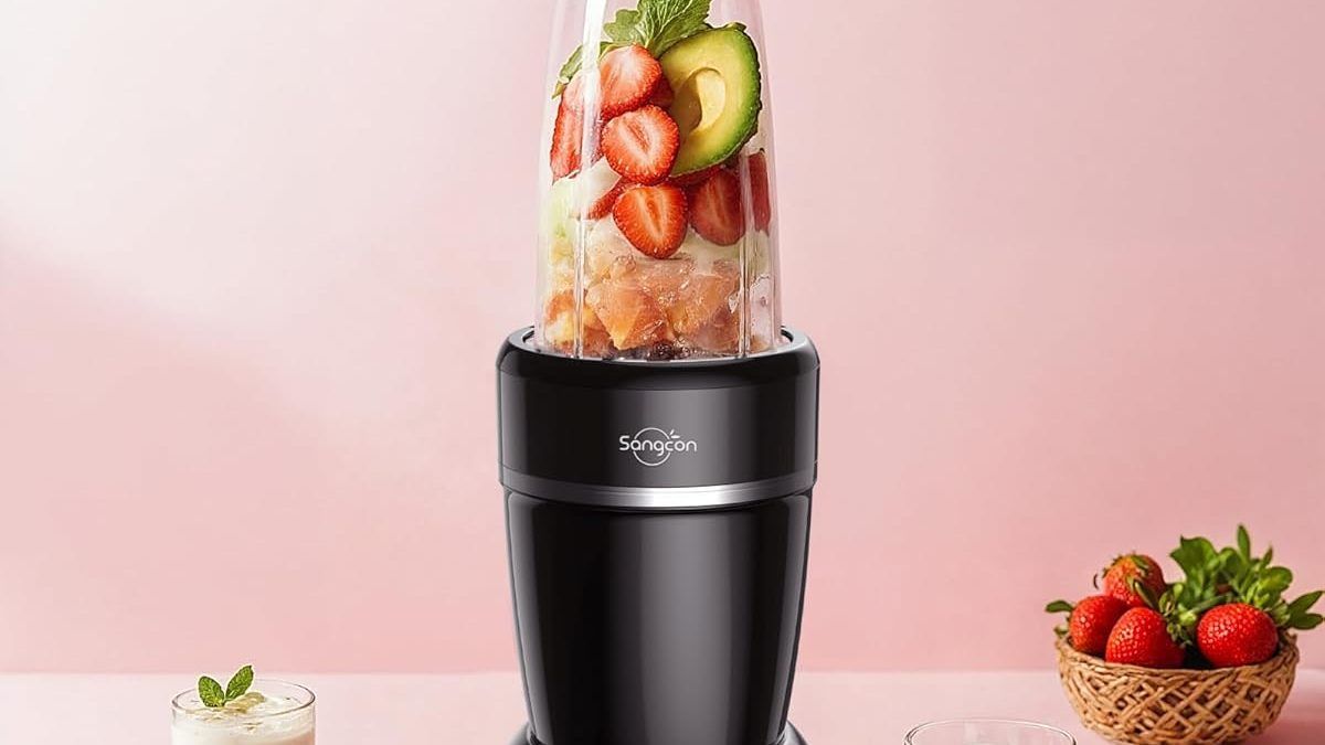 A powerful, black Sangcon 1000W blender with a large glass pitcher sits on a kitchen counter. The blender base has a control panel with various settings, and the lid is secured on top. The scene suggests the blender is ready for making smoothies or other blended drinks.