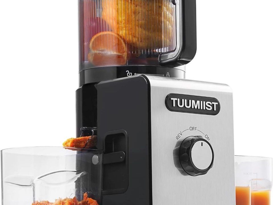 TUUMIIST Cold Press Juicer with large chute extracting fresh fruit and vegetable juice.