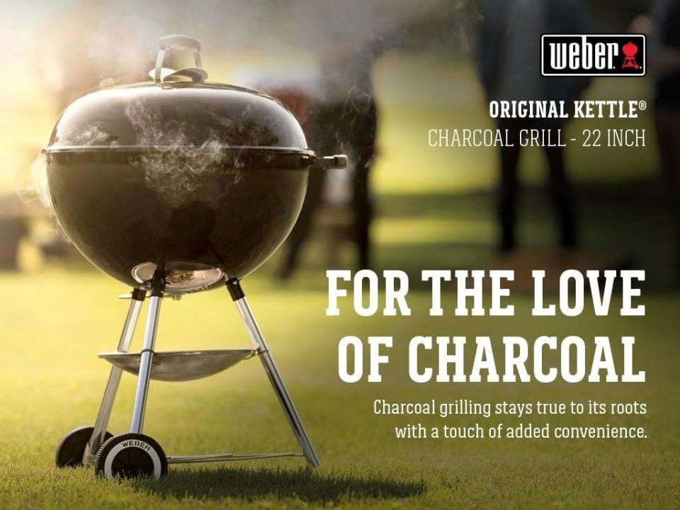 Front view of Weber Original Kettle 22″ charcoal grill with lid closed, showing compact design and durable wheels.