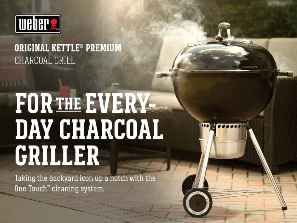 Front view of Weber Original Kettle 22″ charcoal grill with lid closed, showing compact design and durable wheels.