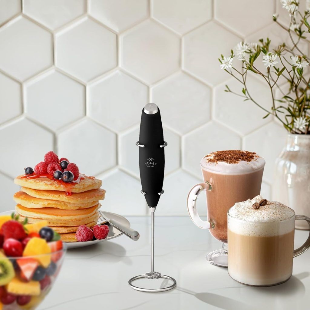 Close-up of Zulay Kitchen milk frother in action, whipping milk into creamy foam for a homemade latte.