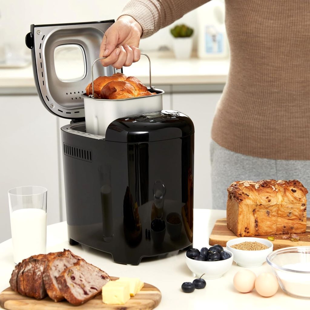 Compact 2lb bread machine on kitchen counter, designed for easy and consistent homemade bread baking.