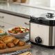 Deep fryer filtering clean canola oil into storage box on kitchen counter