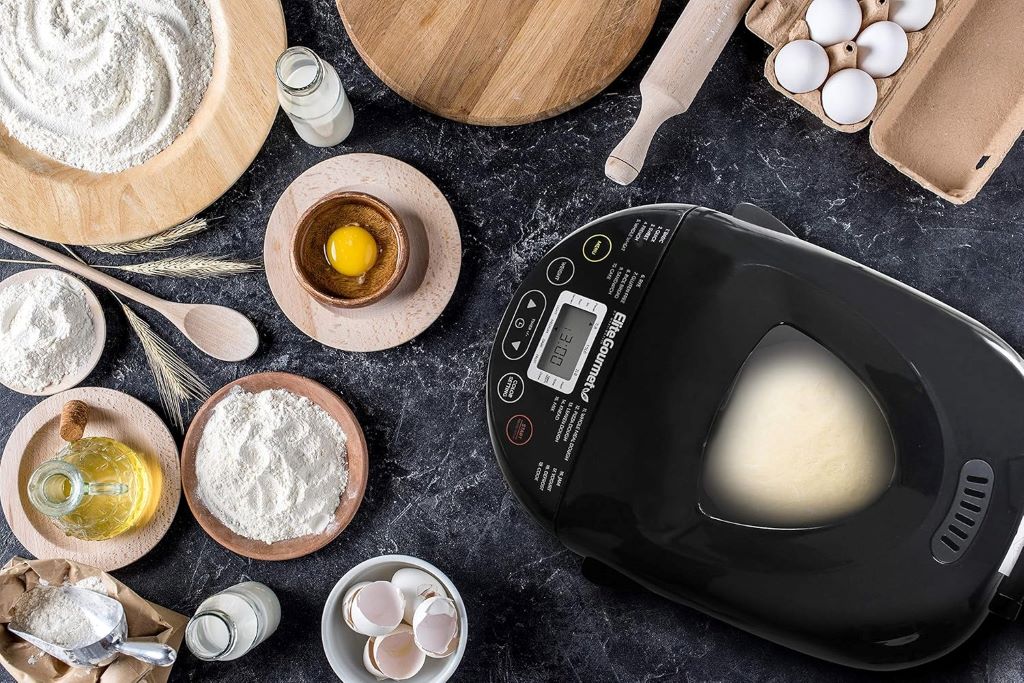 Programmable Elite Gourmet EBM8103B machine baking white, wheat, and gluten-free bread.