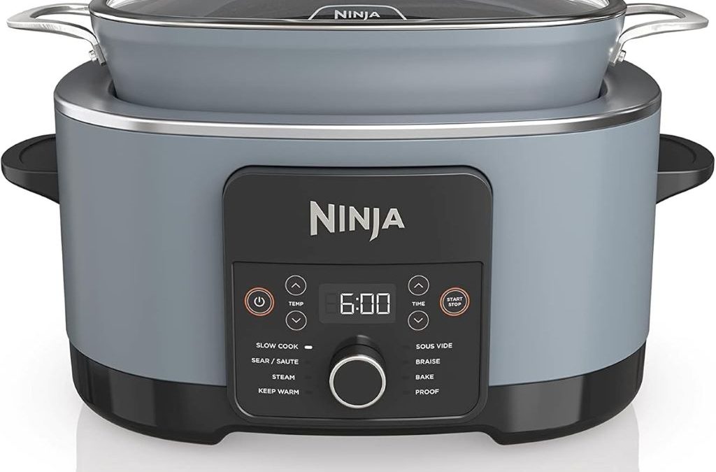 Ninja Foodi PossibleCooker PRO 8.5Qt multi-cooker on kitchen counter with glass lid and spoon