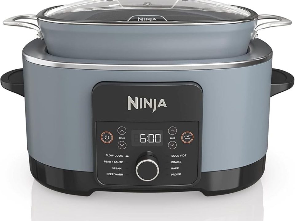 Ninja Foodi PossibleCooker PRO 8.5Qt multi-cooker on kitchen counter with glass lid and spoon