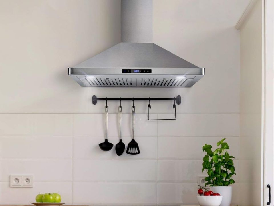 Modern 30-inch COSMO range hood from the Vista Collection installed in a contemporary kitchen