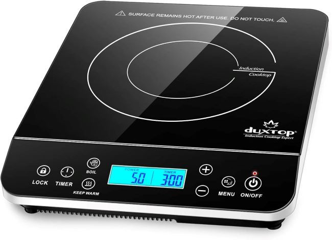 Duxtop portable induction cooktop with LCD touch controls on a kitchen countertop