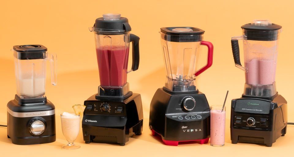 Powerful blender making fresh fruit smoothie in a modern kitchen.