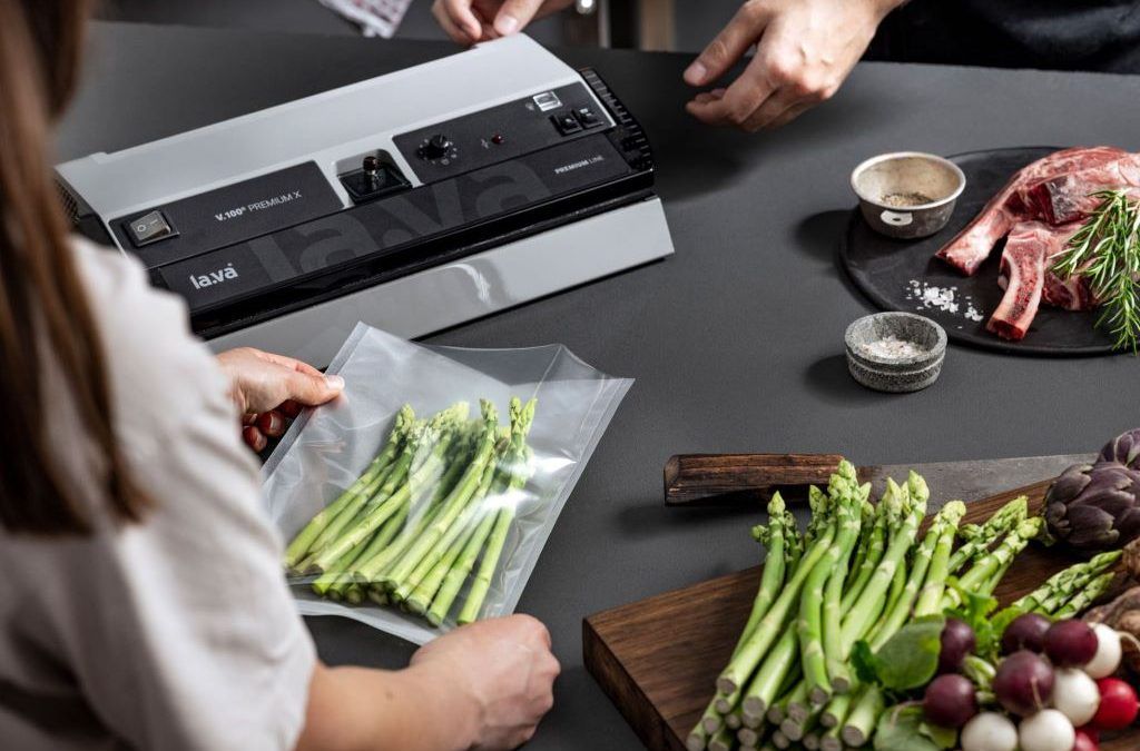 Food vacuum sealer machine sealing fresh ingredients to extend shelf life