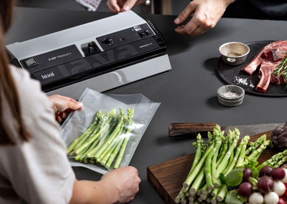 Food vacuum sealer machine sealing fresh ingredients to extend shelf life