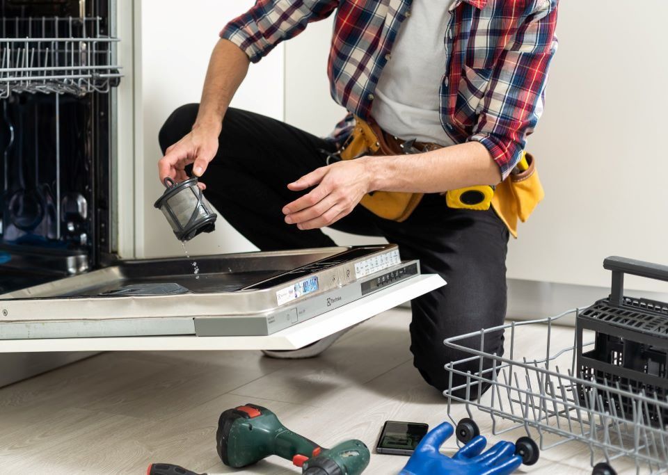 Maintaining household appliances with regular cleaning and care to prevent costly repairs