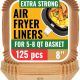 Baker's Signature air fryer paper liners in an air fryer basket in California
