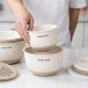Umite Chef mixing bowls nested neatly inside kitchen cabinet