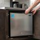Whynter CUF 112SS mini upright freezer in compact kitchen