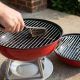Cuisinart 14 inch charcoal grill with charcoal ready for cooking